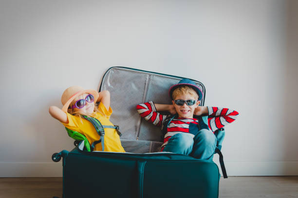 kids in a suitcase travel concept. Child's passport application.