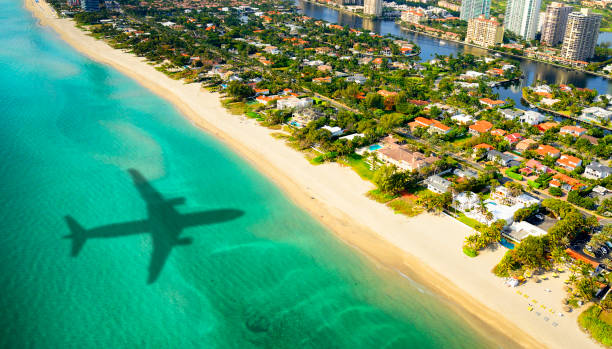 Airplane flying in Miami, Florida, USA. How to Get an Expedited Passport in Miami Before Your Vacation
