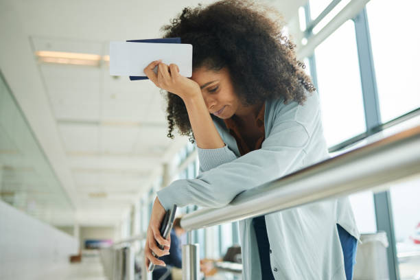 Travel, a woman at airport with anxiety, trouble and missed departure alone at a terminal. expired passport at the airport