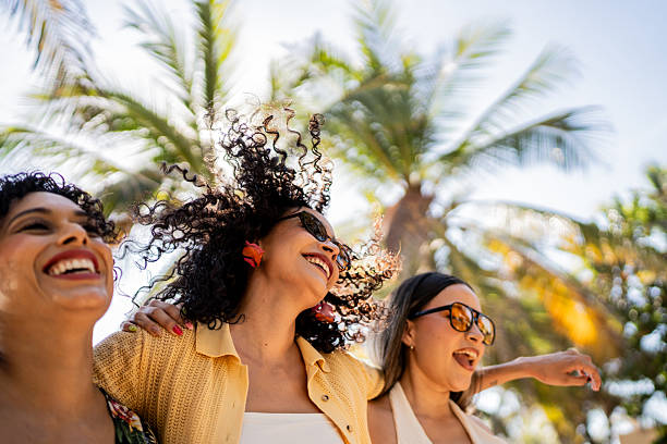 Friends women during party outdoors travel concept. Why Passport Processing Times Change Throughout the Year