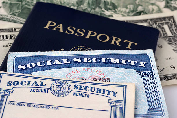"Close up photograph of social security cards & passport, selective focus.Similar Images:"\\ passport and taxes