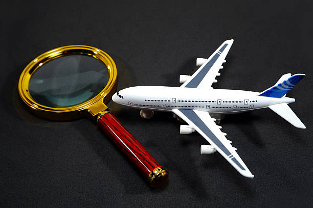 what is proof of travel for an expedited passport\\ Small scale white airplane model positioned beside a large magnifying glass with a rich wooden handle represents deep analysis of air travel options, security details, or complex transportation schedules requiring meticulous examination and focused searching.